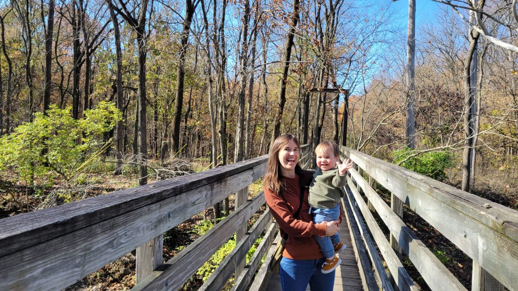 Photo of the PI, Sarah Castle, with her child at a park