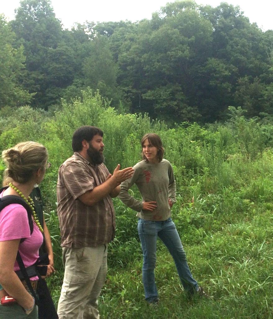 Three people discussing agroforestry systems in southern Illinois 2017
